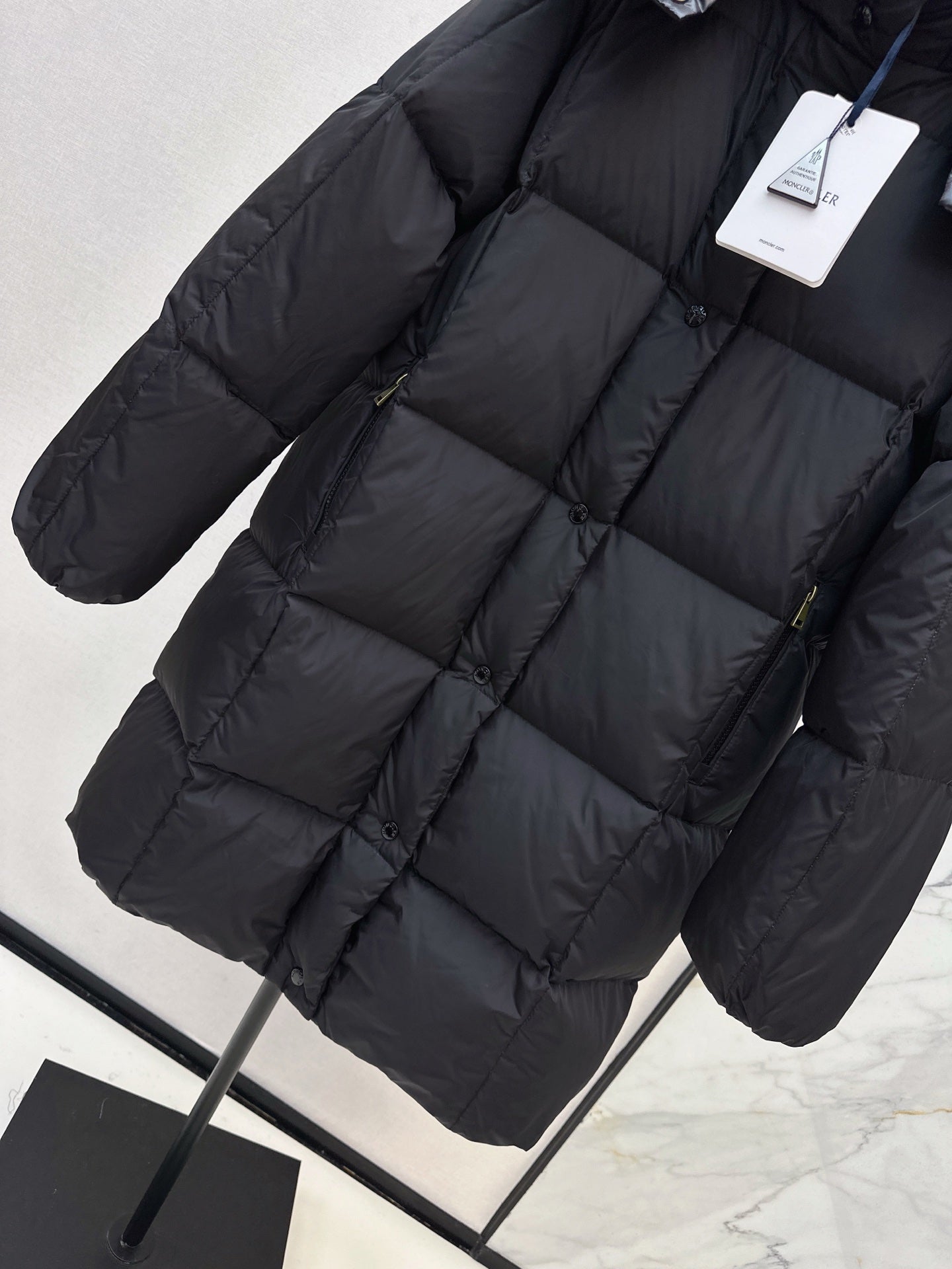 mid-length down jacket with hood and sleeve badge