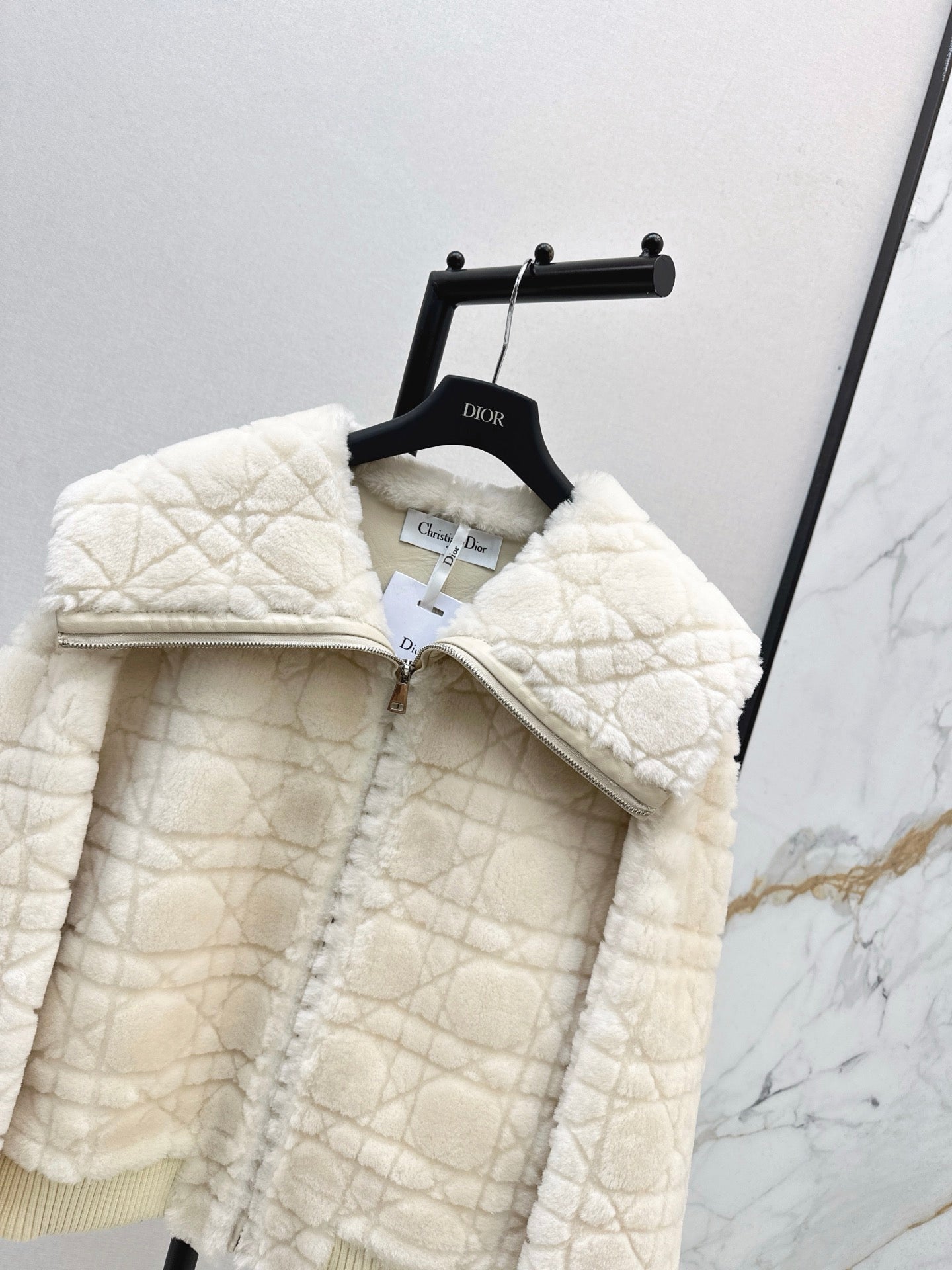 Check fur coat with large lapels
