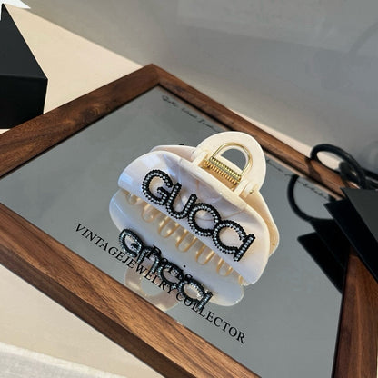 Diamond logo hair clip