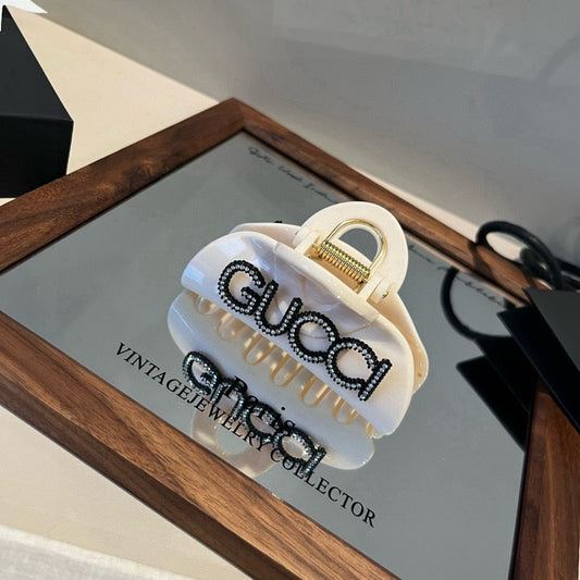 Diamond logo hair clip